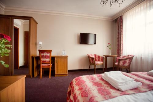Postel nebo postele na pokoji v ubytování Hotel przy Młynie