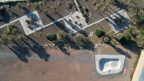 an overhead view of a pool in a park with trees at Casa Playa Ondina in Gáldar