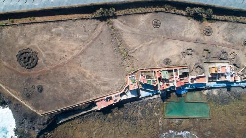 an aerial view of a building in the dirt at Casa Playa Ondina in Gáldar