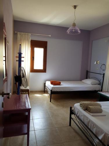 Posteľ alebo postele v izbe v ubytovaní Villa Ikarus