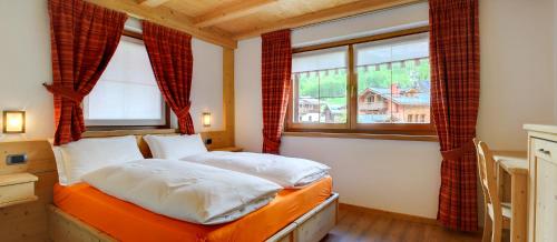 Ένα ή περισσότερα κρεβάτια σε δωμάτιο στο Chalet Mott