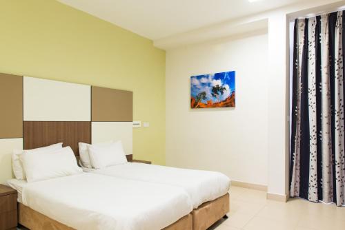 Säng eller sängar i ett rum på HI - Poriya Hostel