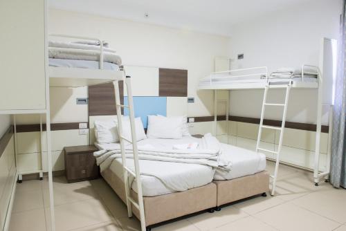 a room with two bunk beds in it at HI - Akko Knights Hostel in Acre