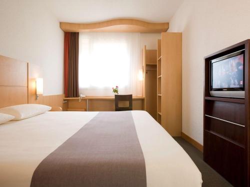 Postel nebo postele na pokoji v ubytování Ibis Cotonou