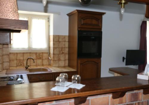 A kitchen or kitchenette at Hotel Le Rivage