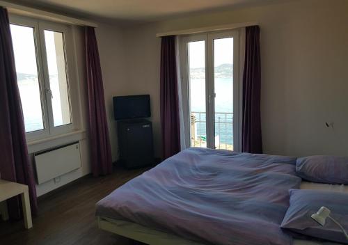 Postel nebo postele na pokoji v ubytování Hotel Le Rivage