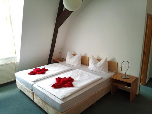 Ein Bett oder Betten in einem Zimmer der Unterkunft Altstadtpension Brandenburg