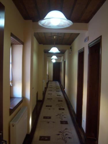 a hallway in a house with a ceiling at Manis Hotel in Nimfaíon