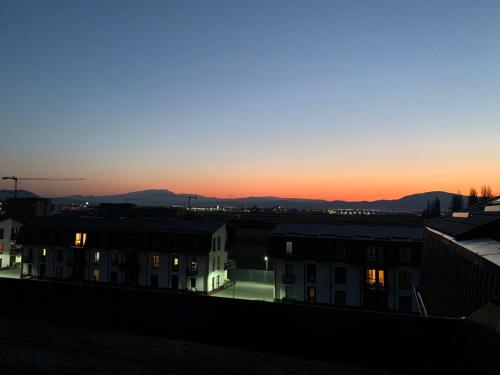 a view of the sunset from the roof of a building at Excentric Studio 2 in Braşov
