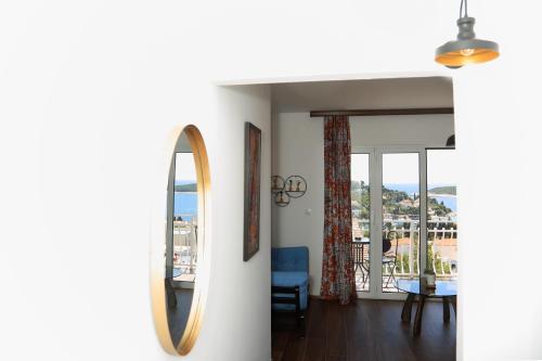 a room with a mirror and a dining room at Tanya-Apartments and Rooms in Hvar