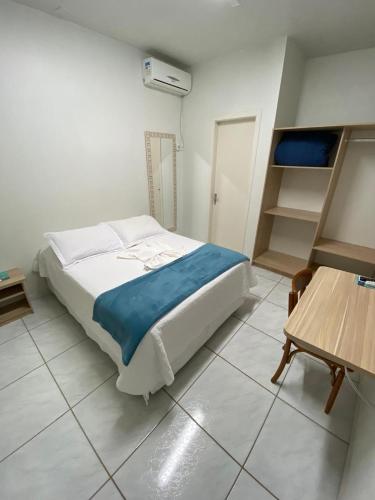 Katil atau katil-katil dalam bilik di Oasis Hotel