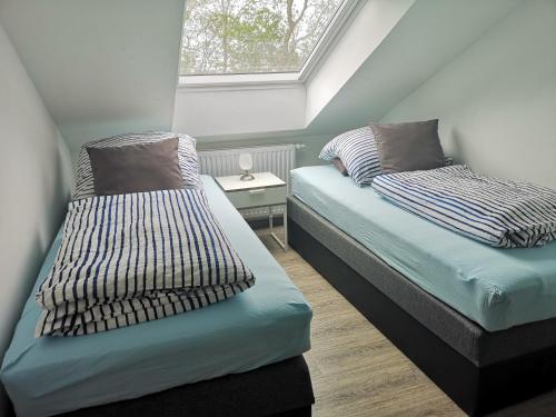 Кровать или кровати в номере Landhaus Kaisershof - Ferienwohnungen auf dem Land