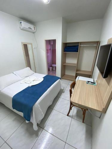 Katil atau katil-katil dalam bilik di Oasis Hotel