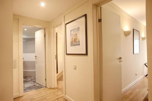 a hallway with a door leading to a bathroom at Green Executive Apartment in the heart of Lisbon in Lisbon