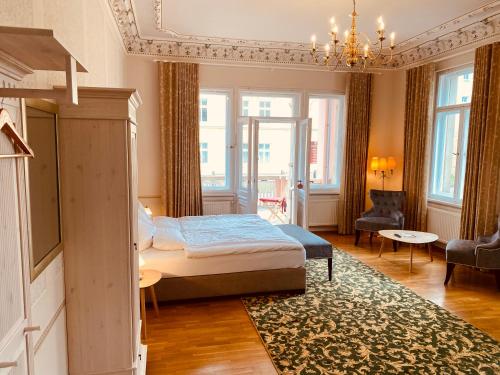 a bedroom with a bed and a living room at Villa Antonia in Bautzen