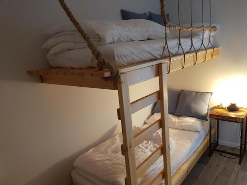 a couple of bunk beds in a room at Jantar 4 Park Bursztynowa in Jantar