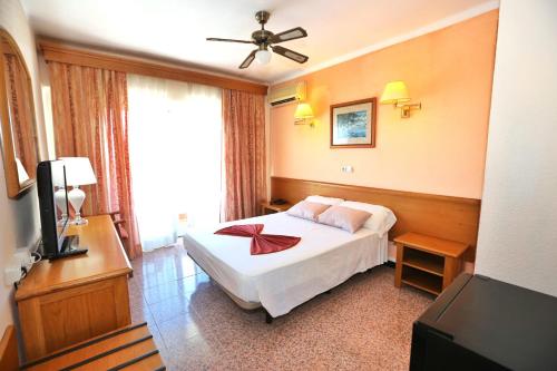 Postel nebo postele na pokoji v ubytování Hotel Manaus