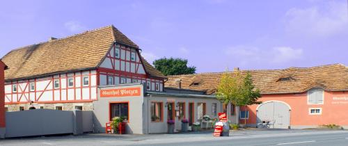 a group of buildings on a street in a town at Ferienhof Plotzen in Hochkirch