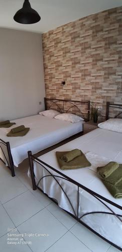 Postel nebo postele na pokoji v ubytování SEA VIEW APARTMENTS Artemis