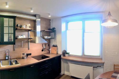 A kitchen or kitchenette at New comfortable apartment nearby promenade in 5 minutes from Old town of Riga.