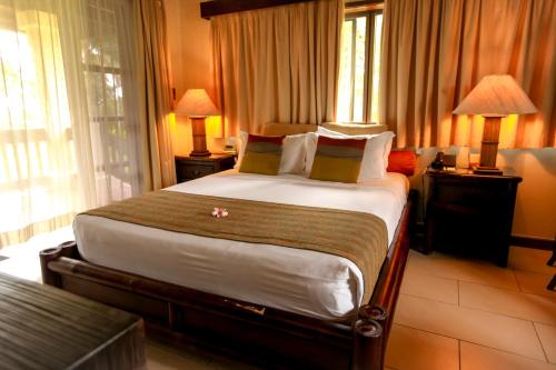 Postel nebo postele na pokoji v ubytování Warwick Le Lagon Resort & Spa, Vanuatu
