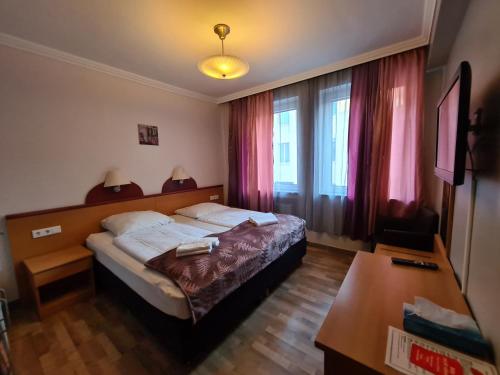 Postel nebo postele na pokoji v ubytování Hotel Cara Vita Cologne