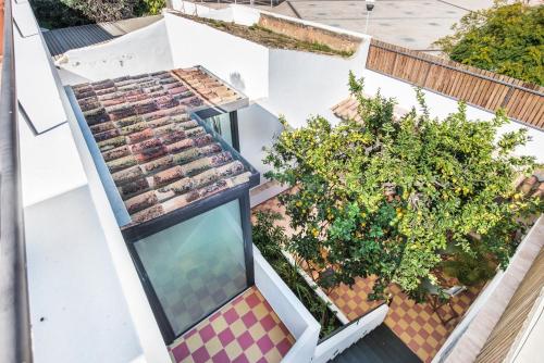 an overhead view of a building with a window at Lemon Tree Stay in Faro