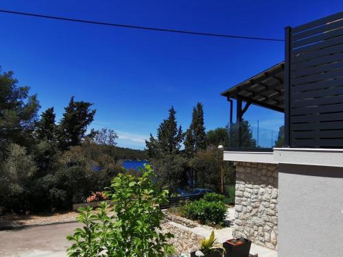 a view of the water from a house at Villa Poljana in Mali Lošinj