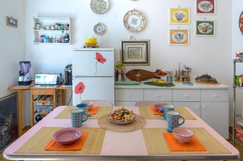 a kitchen with a table with a bowl of food on it at Panorami sul Trasimeno in San Feliciano