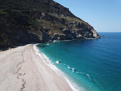 an aerial view of a beach next to a mountain at 3SSS Bouquet Studios in Marmarion