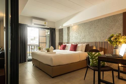 Katil atau katil-katil dalam bilik di The Home Hotel SHA