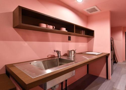 Η κουζίνα ή μικρή κουζίνα στο HOTEL PINK HIBISCUS