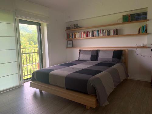 Un pat sau paturi într-o cameră la Cottage del fiume