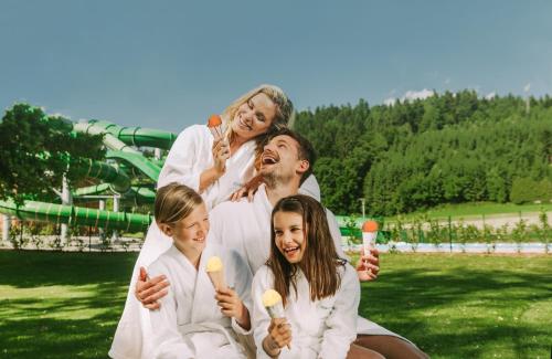 a group of people in white robes eating ice cream at Hotel Balnea Superior - Terme Krka in Dolenjske Toplice