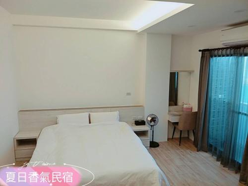 Postel nebo postele na pokoji v ubytování Penghu Summer Aroma Homestay