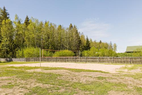 an empty field with a soccer ball on a goal at Kajamaa Holiday Home in Saku