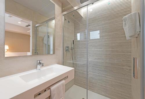 a bathroom with a sink and a shower at La Lonja in Alicante