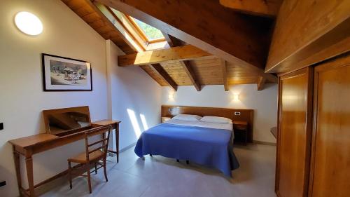 Un pat sau paturi într-o cameră la Residence L'Ulivo