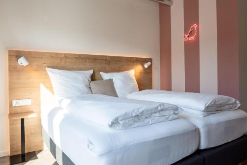 Letto o letti in una camera di coucou hotel & kuckucks-stube (Titisee)