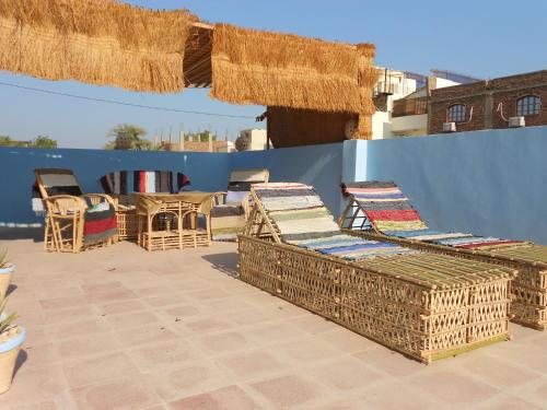 a group of chairs and tables on a patio at Villa Diletta Luxor in Luxor