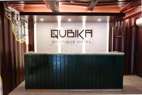 a sign for a boutique hotel in a building at Qubika Boutique Hotel in Tangerang