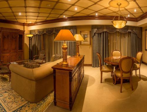 a living room with a couch and a table at Peermont D'oreale Grande at Emperors Palace in Kempton Park
