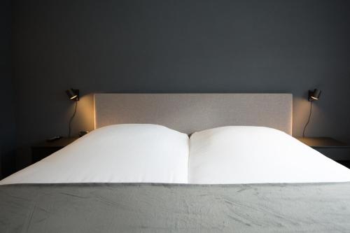 Een bed of bedden in een kamer bij Bed and Breakfast Groningen - Peizerweg