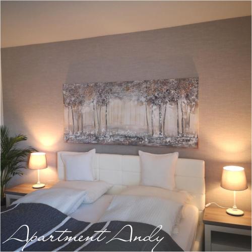 a bedroom with a white bed and a painting on the wall at Apartment Andy in Medvode