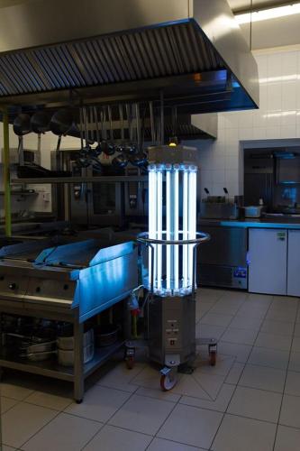 a kitchen with a large appliance in a kitchen at Hotel KARO in Radom