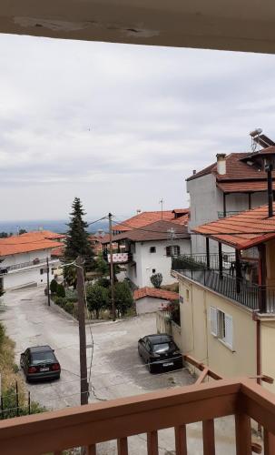 a view of a parking lot from a balcony at OLYMPUS HILL in Litochoro