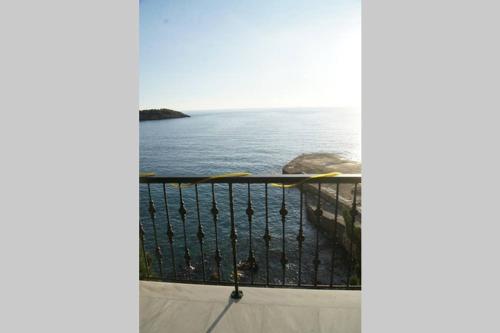 a view of the ocean from a balcony at Seafront Maisonette in Kardamyli in Kardamili