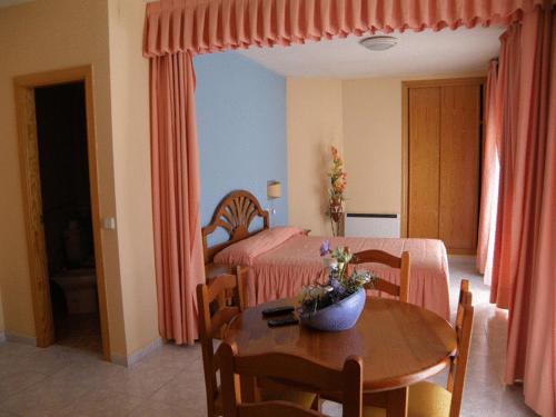 Postel nebo postele na pokoji v ubytování Hotel Laberinto