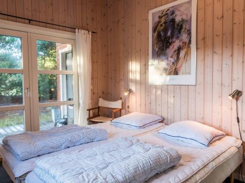 Postel nebo postele na pokoji v ubytování Holiday home Fanø LVI