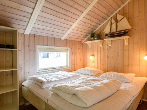 Postel nebo postele na pokoji v ubytování Holiday home Fanø LXII